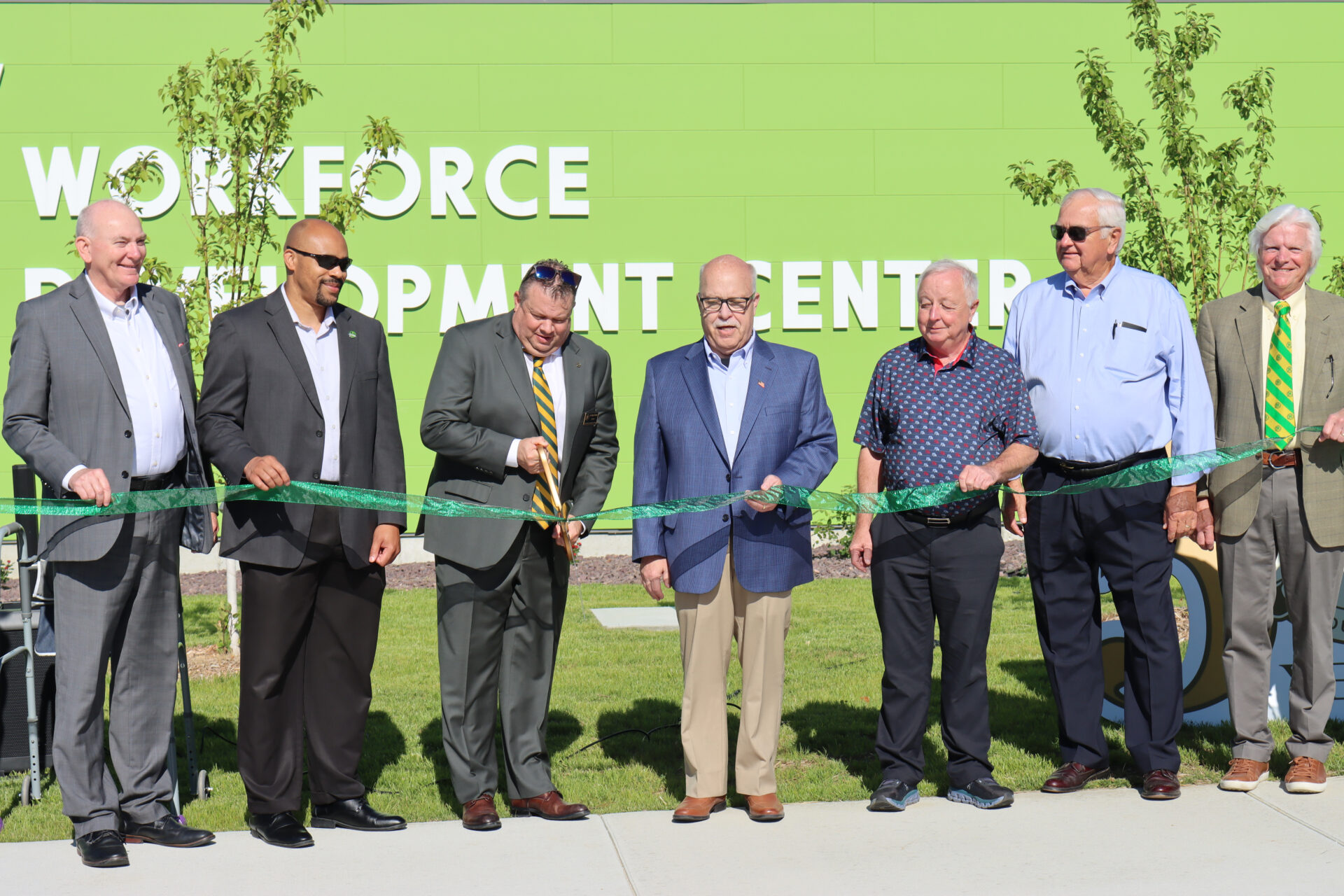 Photo of dignitaries cutting the ribbon on the expansion of JWCC Workforce Development Center.